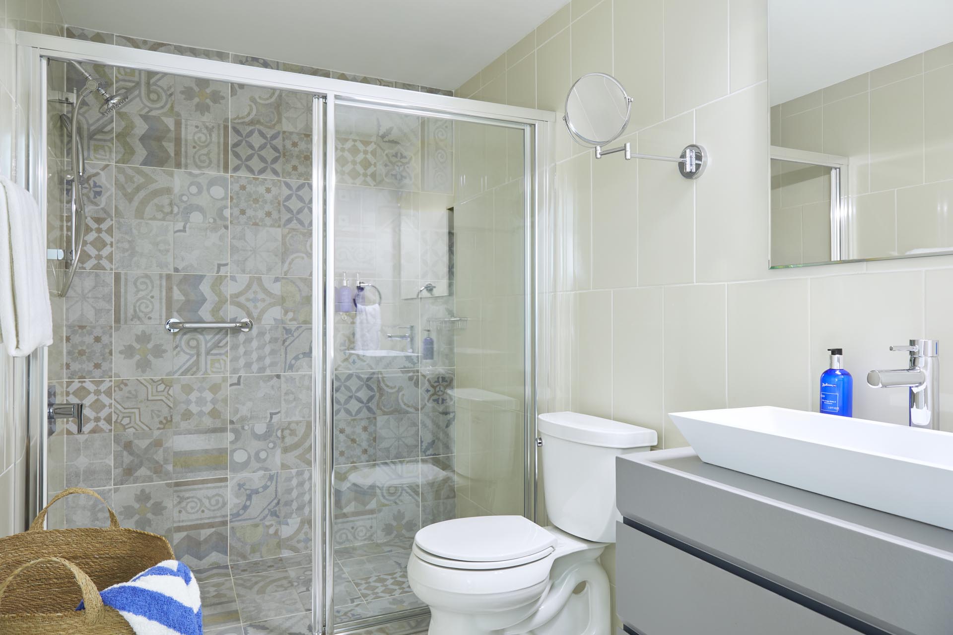 Bathroom with toilet, shower, and vanity