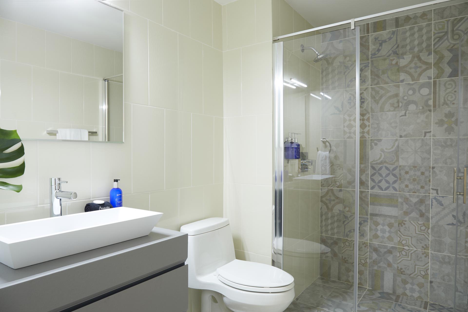 Bathroom with shower, toilet, and vanity