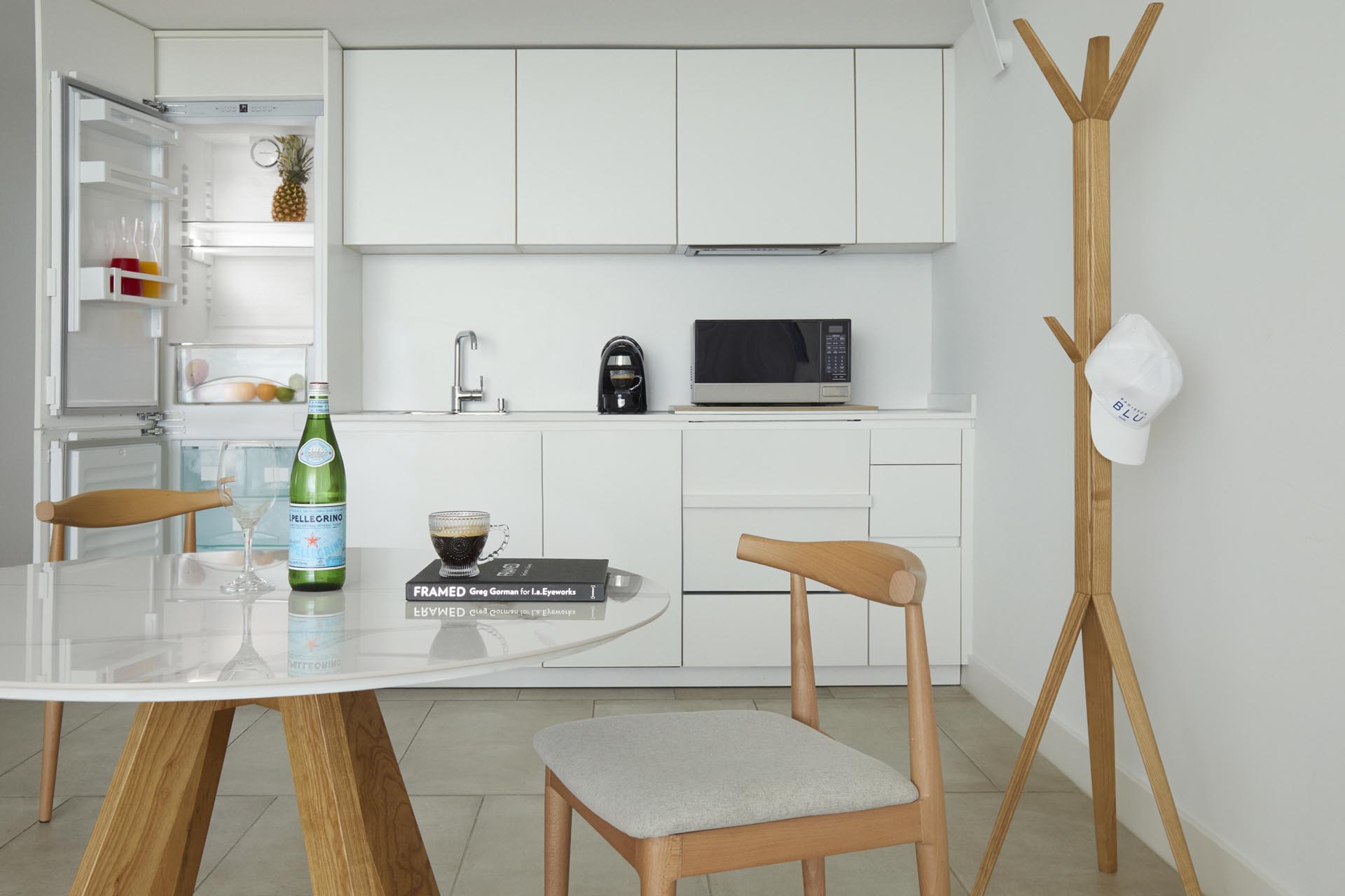 Kitchenette area with refrigerator and microwave