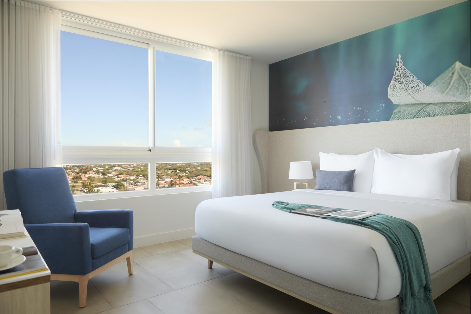 King bed with white sheets and side table