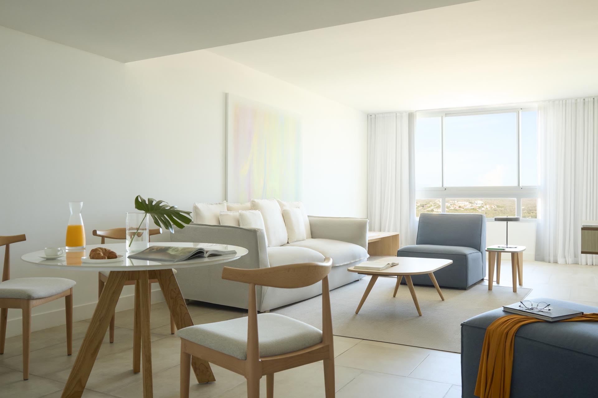 Living room area with sofa and windows overlooking island