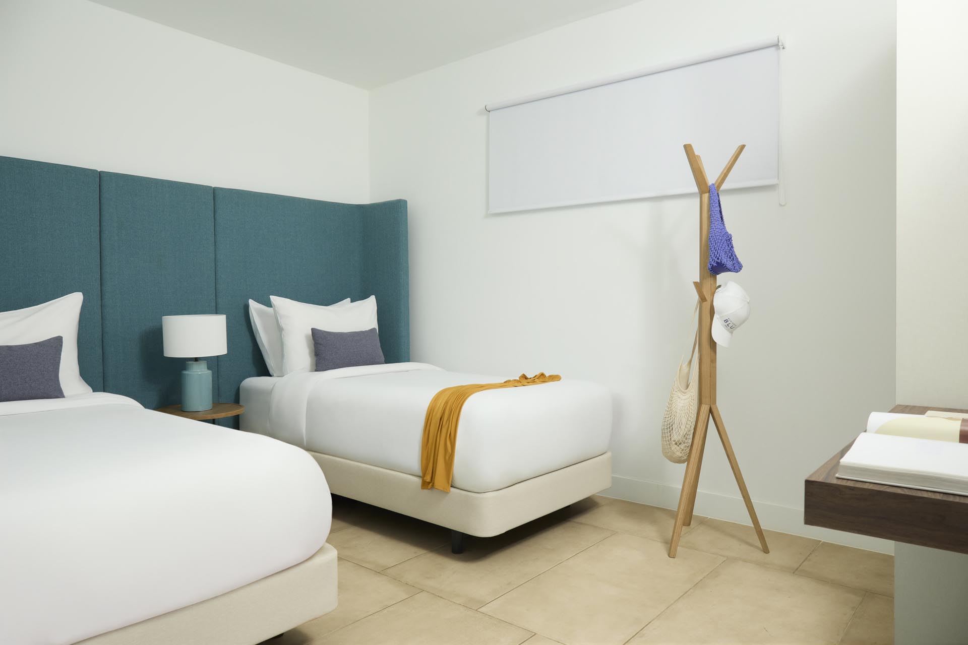 Two twin beds and wall art