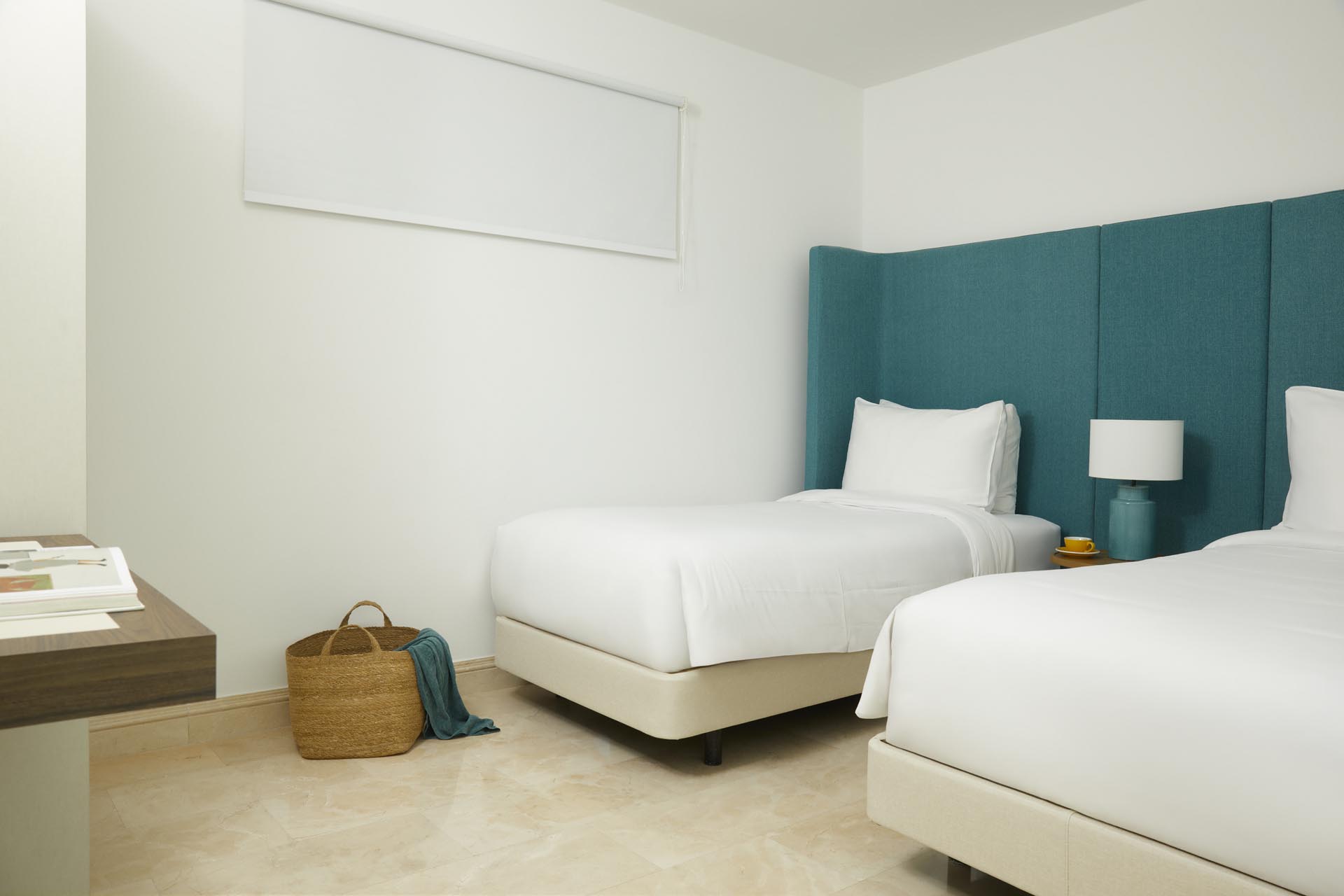 Two twin beds and mounted TV