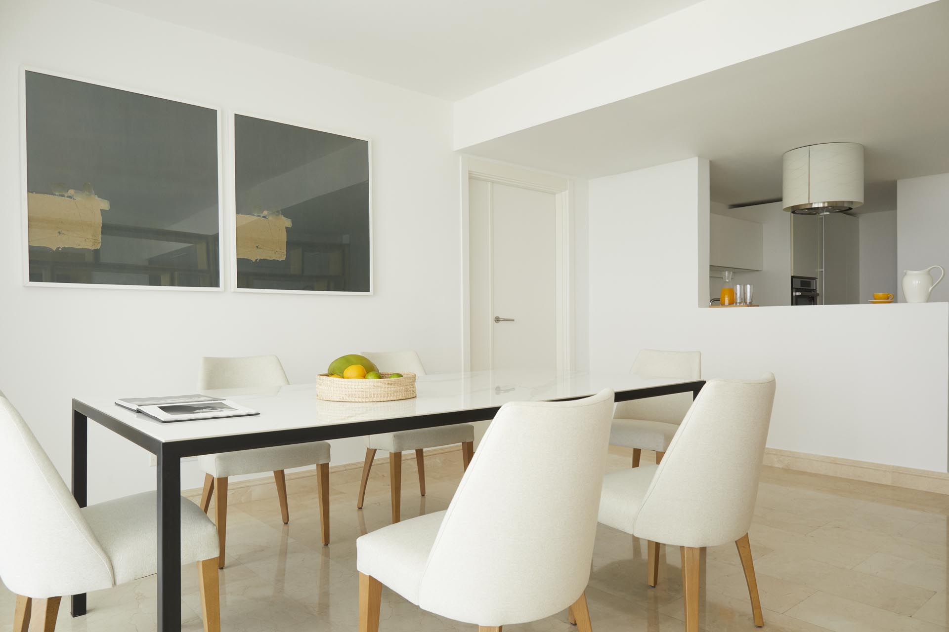 Couch with table, mounted TV and view of balcony