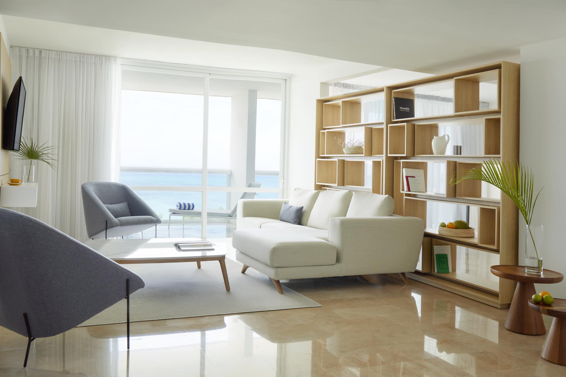 Large windows and mounted TV on wall