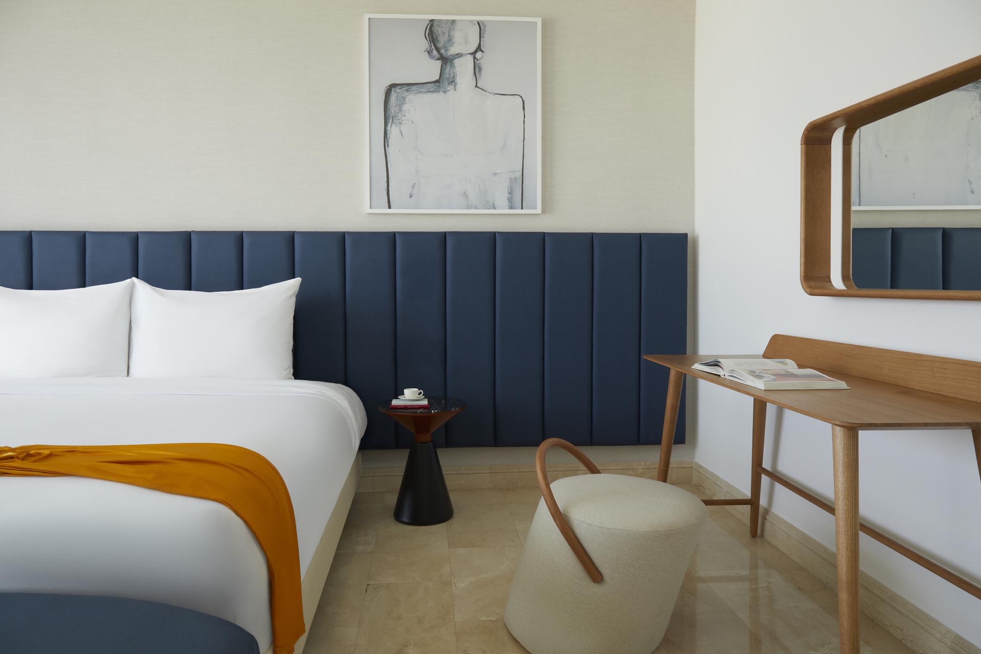 King bed with large windows and side tables with lamp