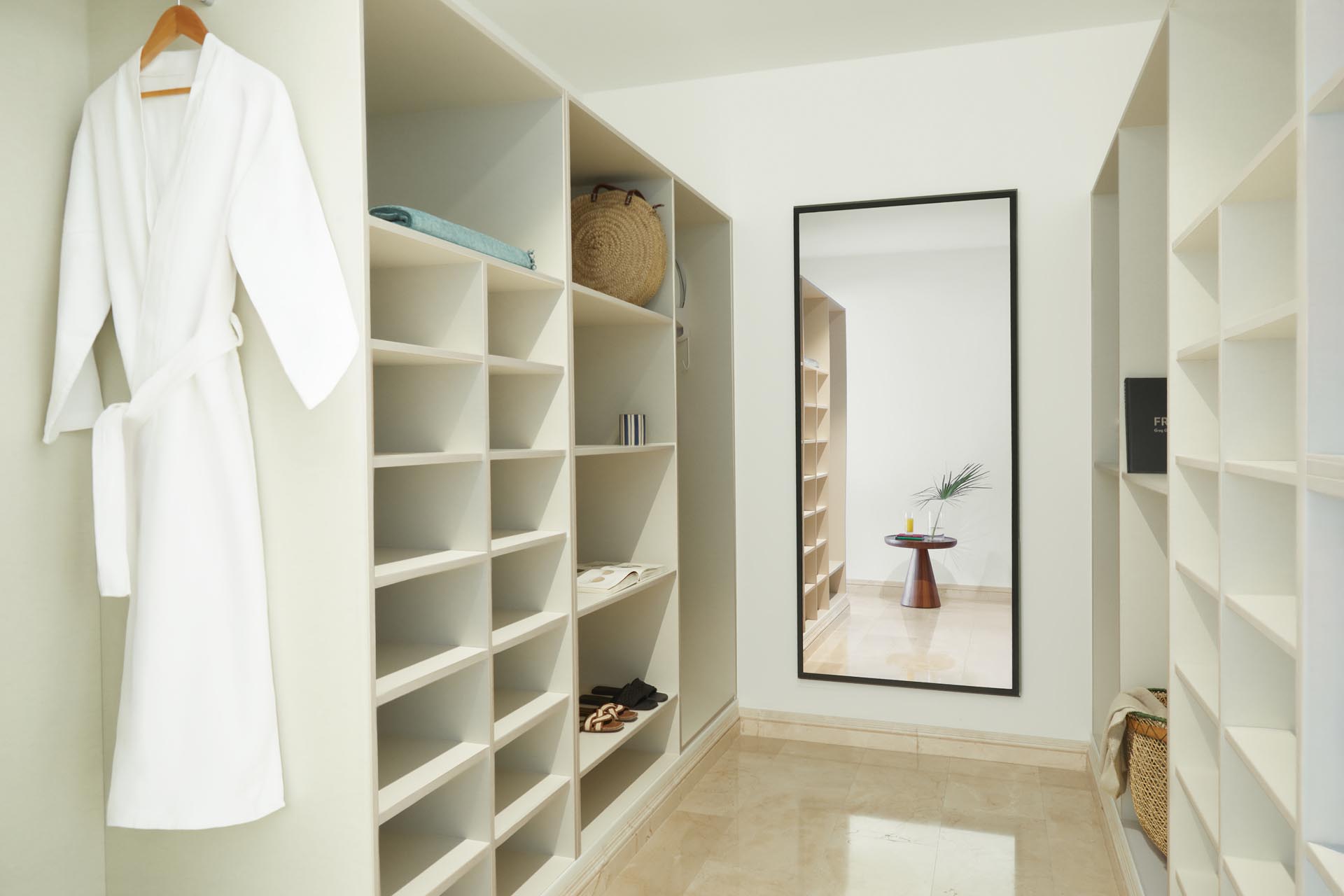 Large walk-in closet with overhead lighting