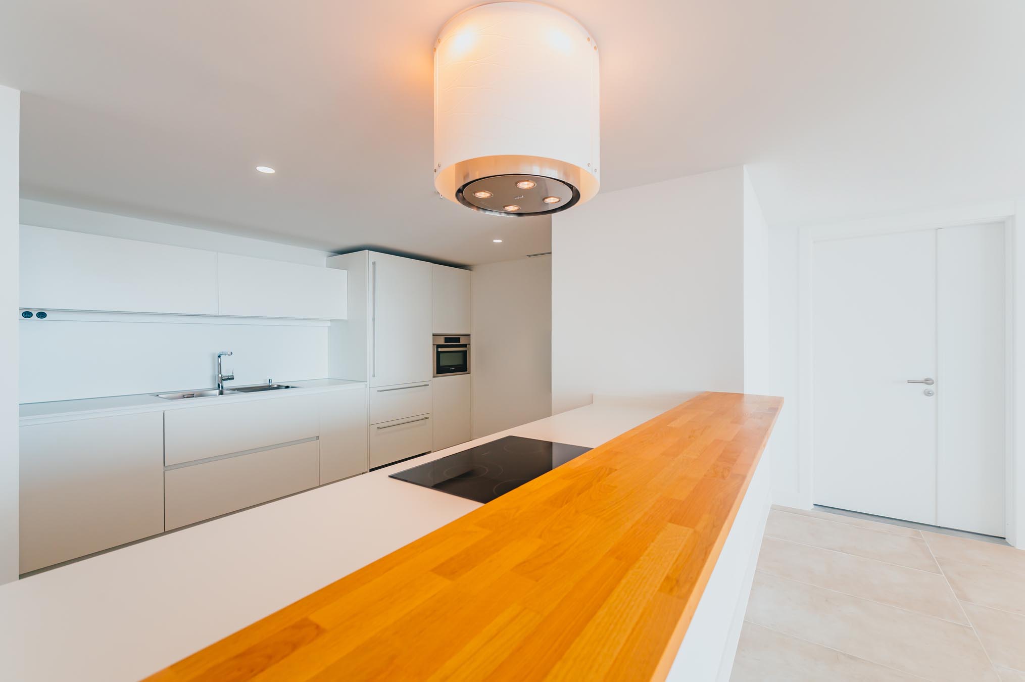 Overhead lighting and kitchen counter